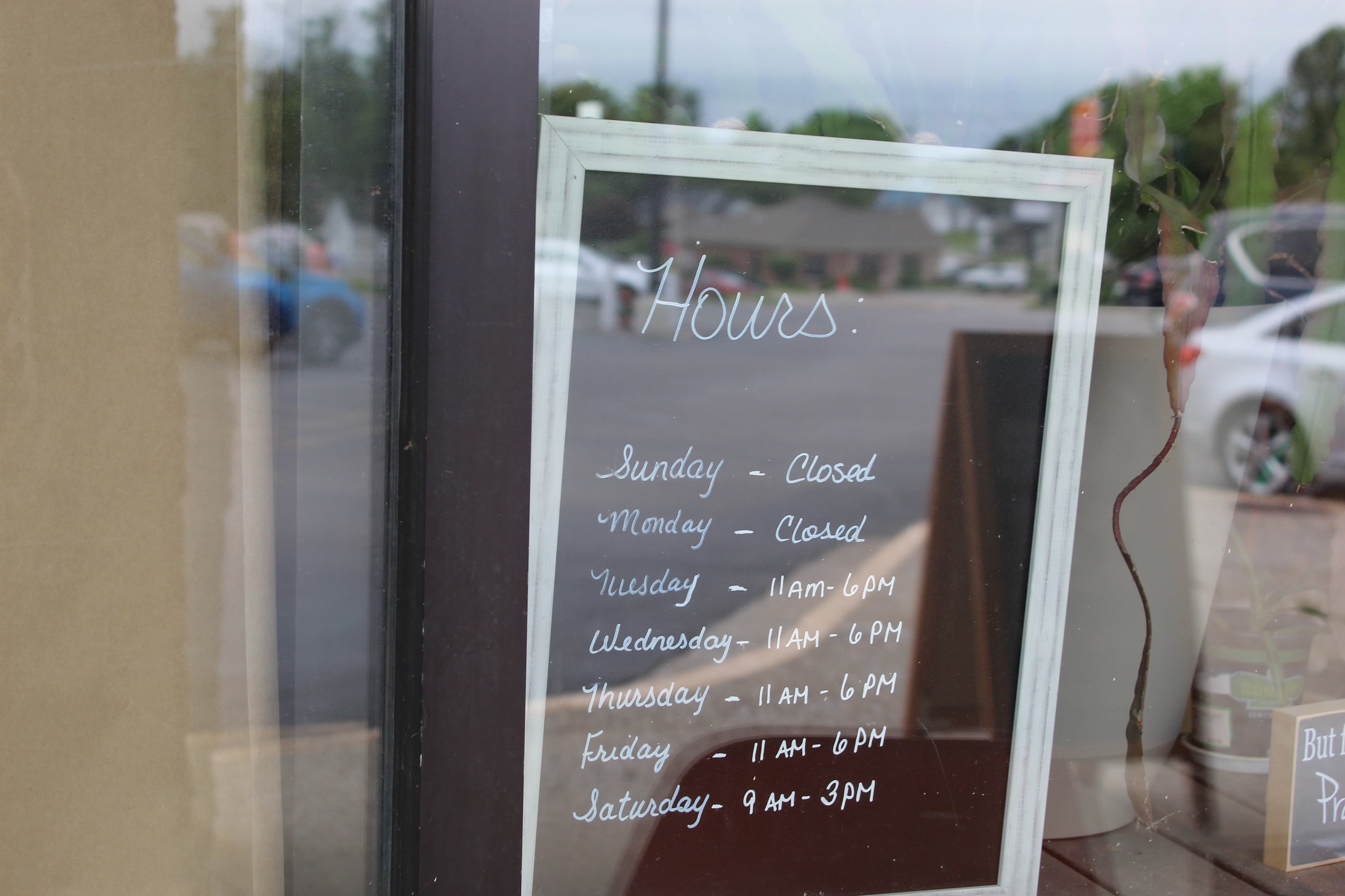 Bedford Refillery and Resale hours sign